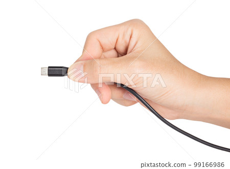 closeup hand holding type c mobile plug closeup hand holding type c mobile plug 99166986
