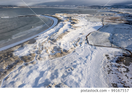Aerial view of snow covered Portnoo in County Donegal, Ireland. Aerial view of snow covered Portnoo in County Donegal, Ireland. 99167557