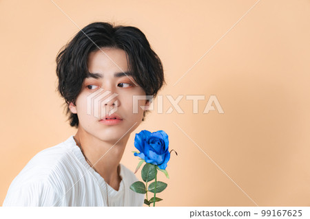 Man with flowers, genderless makeup, men's cosmetics, skin care 99167625