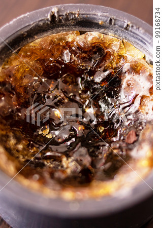 Rosin in a jar on a wooden table 99168734