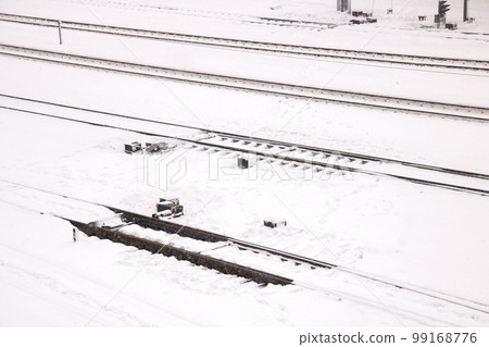 Rails for train in the snow closeup Rails for train in the snow closeup 99168776