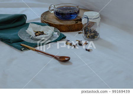 Healthy herbal butterfly pea tea showing the candid moments of home life, slow living and spring aesthetic Healthy herbal butterfly pea tea showing the candid moments of home life, slow living and spring aesthetic 99169439