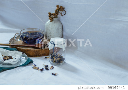 Healthy herbal butterfly pea tea showing the candid moments of home life, slow living and spring aesthetic Healthy herbal butterfly pea tea showing the candid moments of home life, slow living and spring aesthetic 99169441