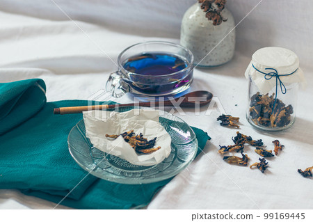 Healthy herbal butterfly pea tea showing the candid moments of home life, slow living and spring aesthetic Healthy herbal butterfly pea tea showing the candid moments of home life, slow living and spring aesthetic 99169445