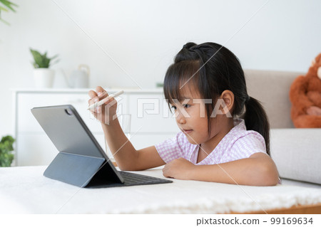Education. Asian little girl learning and drawing with the online teacher on tablet digital Education. Asian little girl learning and drawing with the online teacher on tablet digital 99169634