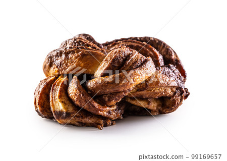 Tasty, sweet cinnamon bun on a stainless isolated on white background 99169657