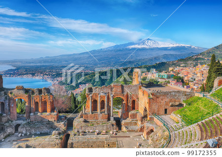 Ruins of ancient Greek theater in Taormina and Etna volcano in the background. Ruins of ancient Greek theater in Taormina and Etna volcano in the background. 99172355