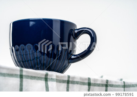 Simple ceramic blue crockery on kitchen counter 99178591