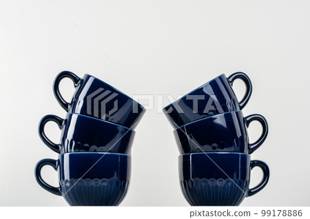 Simple ceramic blue crockery on kitchen counter 99178886