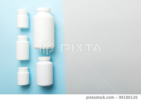 supplement pills with medicine bottle health care and medical top view. Vitamin tablets. Top view mockup bottle for pills and vitamins with green leaves, natural organic bio supplement, copy space supplement pills with medicine bottle health care and medical top view. Vitamin tablets. Top view mockup bottle for pills and vitamins with green leaves, natural organic bio supplement, copy space 99180126