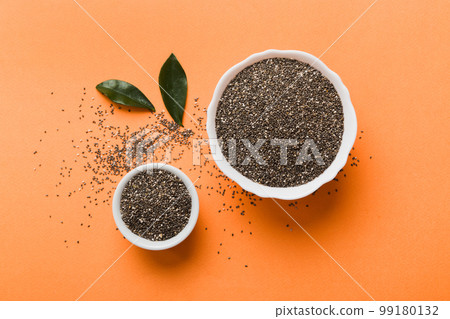 Chia seeds in bowl on colored background. Healthy Salvia hispanica in small bowl. Healthy superfood 99180132