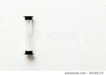 hourglass on the table, sand clock as time passing concept for business deadline, copy space 99180174