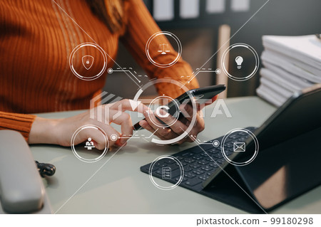 Copyright or patent concept, Person hand using laptop computer, tablet and smartphone with virtual screen copyright icon trademark, Creation ownership against piracy. at office.. Copyright or patent concept, Person hand using laptop computer, tablet and smartphone with virtual screen copyright icon trademark, Creation ownership against piracy. at office.. 99180298