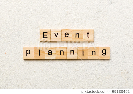 Event planning word written on wood block. Event planning text on table, concept 99180461