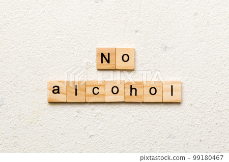 No alcohol word written on wood block. No alcohol text on cement table for your desing, Top view concept No alcohol word written on wood block. No alcohol text on cement table for your desing, Top view concept 99180467