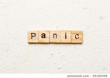 panic word written on wood block. panic text on table, concept panic word written on wood block. panic text on table, concept 99180499