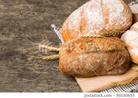 Homemade natural breads. Different kinds of fresh bread as background, perspective view with copy space 99180693
