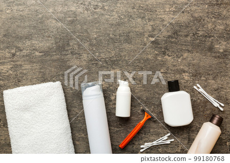 Composition with bath cosmetics on table. razor, toothpaste, soap, gel, toothbrush, mouthwash and other various accessories. Cosmetics for skin health. Bath Mockup for your logo 99180768