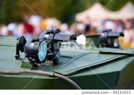 The front lights of an armored personnel carrier APC in close-up. The front lights of an armored personnel carrier APC in close-up. 99181655