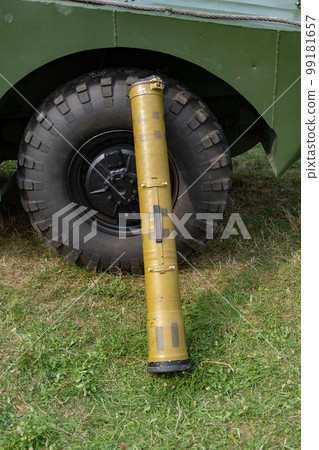 An anti-tank grenade launcher near the wheel of an armored personnel carrier. An anti-tank grenade launcher near the wheel of an armored personnel carrier. 99181657