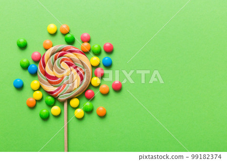 Tasty appetizing Party Accessories Happy Birthday Sweet. Different types of candies on colored background, copy space. Colorful birthday party background Tasty appetizing Party Accessories Happy Birthday Sweet. Different types of candies on colored background, copy space. Colorful birthday party background 99182374