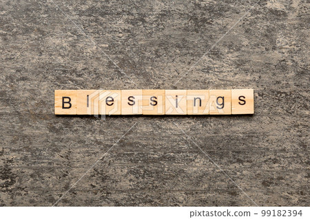 Blessings word written on wood block. Blessings text on cement table for your desing, Top view concept Blessings word written on wood block. Blessings text on cement table for your desing, Top view concept 99182394