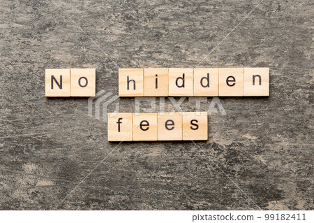 No hidden fees word written on wood block. No hidden fees text on cement table for your desing, Top view concept No hidden fees word written on wood block. No hidden fees text on cement table for your desing, Top view concept 99182411