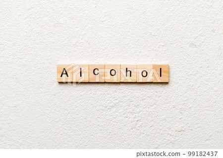 alcohol word written on wood block. alcohol text on table, concept alcohol word written on wood block. alcohol text on table, concept 99182437