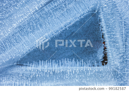 Close-up of frost textures on the ground. Frost needles Close-up of frost textures on the ground. Frost needles 99182587