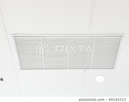 Ceiling mounted cassette type air conditioner and modern lamp light on white ceiling. duct air conditioner for home or office 99184313