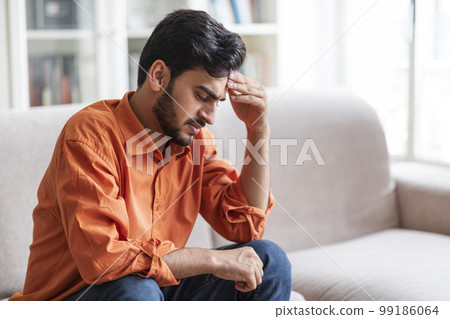Unhappy middle eastern young man experiencing problems Unhappy middle eastern young man experiencing problems 99186064