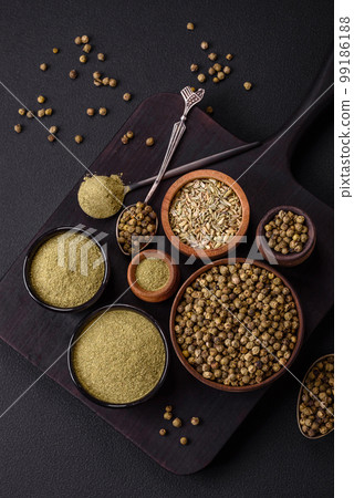 Spice dried dill or basil in the form of green powder Spice dried dill or basil in the form of green powder 99186188