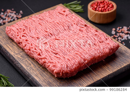 Raw beef or pork mince with salt spices and herbs Raw beef or pork mince with salt spices and herbs 99186284