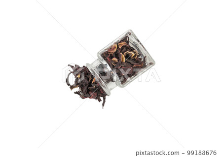 Dry hibiscus tea falling from glass jar isolated on white background. herb. herbal tea. food ingredient. Dry hibiscus tea falling from glass jar isolated on white background. herb. herbal tea. food ingredient. 99188676
