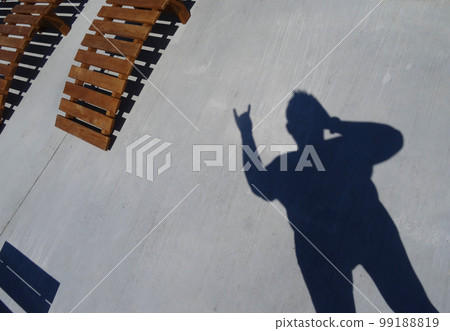 Man Casts A Shadow With Cool Hand Gesture 99188819