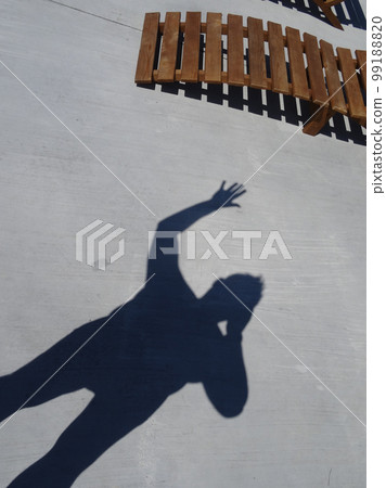 Shadow Of Man With Hand Welcome Sign On Concrete Floor 99188820