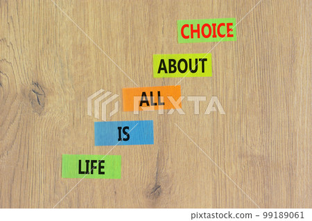 Choice and life symbol. Concept words Life is all about choice on colored paper. Beautiful wooden table wooden background. Business choice and life concept. Copy space. 99189061