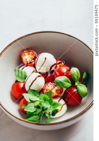 Freshly made italian salad caprese Freshly made italian salad caprese 99189475