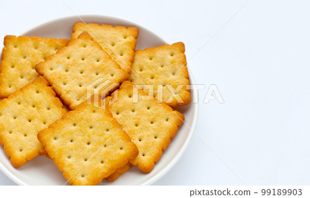 Dry cracker cookies on white background. Dry cracker cookies on white background. 99189903