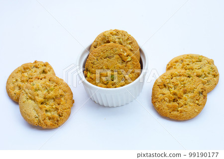 pistachio and almond cookies on white background. 99190177