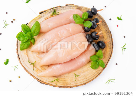 Raw chicken inner on skewers with olives with spices,herbs on white background.Uncooked Chicken meat,kebab on skewers.Skewers of raw meat and vegetables.Top view.Chicken Skewers breast fillet meat. Raw chicken inner on skewers with olives with spices,herbs on white background.Uncooked Chicken meat,kebab on skewers.Skewers of raw meat and vegetables.Top view.Chicken Skewers breast fillet meat. 99191364