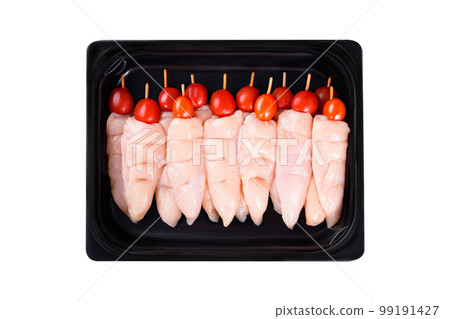 raw chicken inner on skewers with tomatoes in a tray on a white background.Close-up.Top view.Raw chicken skewers. raw chicken inner on skewers with tomatoes in a tray on a white background.Close-up.Top view.Raw chicken skewers. 99191427