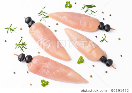 Raw chicken inner on skewers with olives with spices,herbs on white background.Uncooked Chicken meat,kebab on skewers.Skewers of raw meat and vegetables.Top view.Chicken Skewers breast fillet meat. 99191452