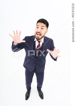 A man in a suit with a surprised expression A man in a suit with a surprised expression 99191818