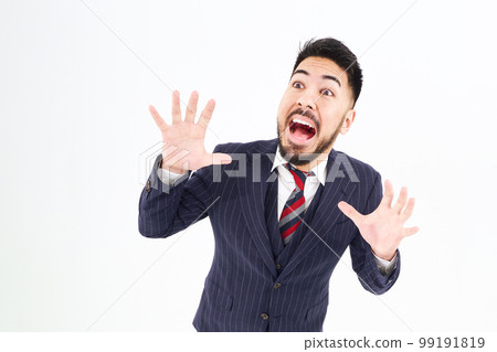A man in a suit with a surprised expression A man in a suit with a surprised expression 99191819