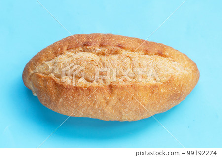 Bread isolated on blue background 99192274