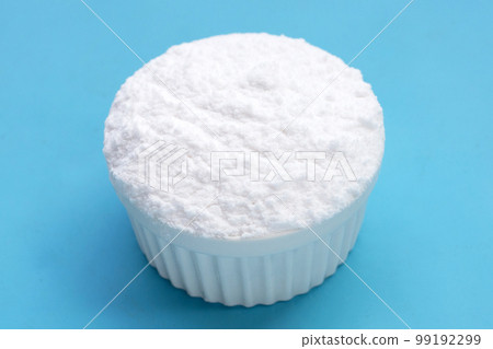 Baking soda on blue background. Baking soda on blue background. 99192299
