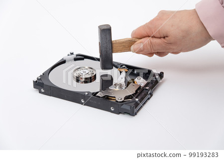 [Woman destroying HDD with a hammer] 99193283