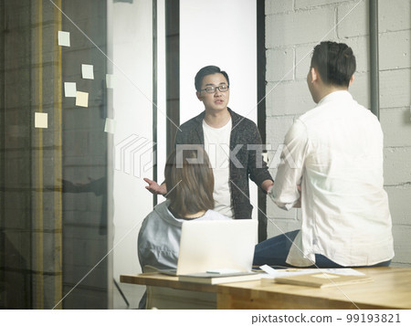 three young asian entrepreneurs meeting in office discussing business 99193821