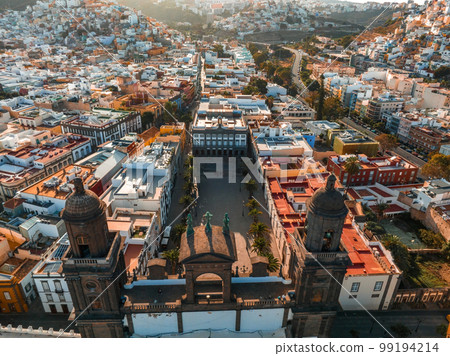 Landscape with Cathedral Santa Ana Vegueta in Las Palmas, Gran Canaria, Canary Islands, Spain. Aerial sunset view of the Las Palmas city. Landscape with Cathedral Santa Ana Vegueta in Las Palmas, Gran Canaria, Canary Islands, Spain. Aerial sunset view of the Las Palmas city. 99194214